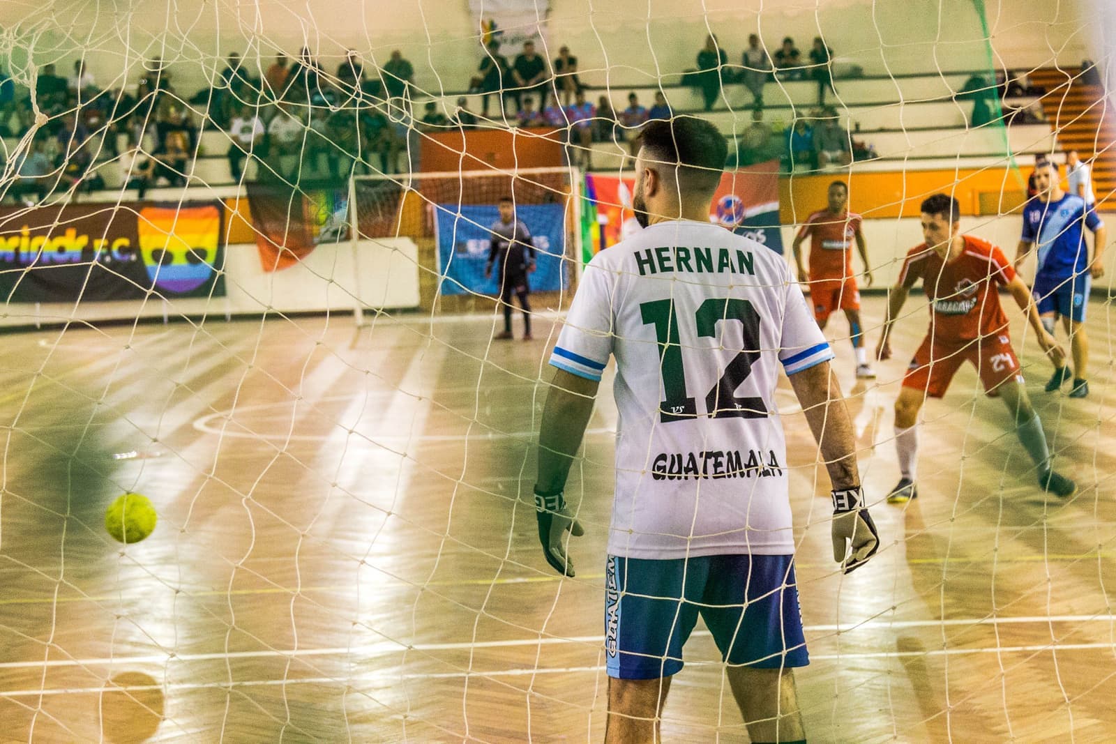 Young players on an indoor soccer court