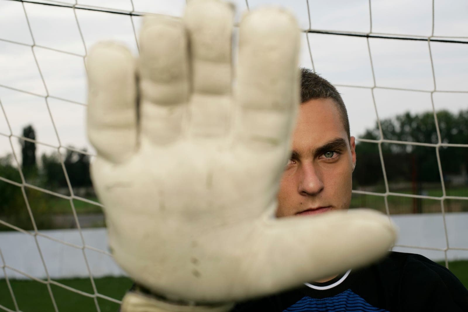 Goalkeeper gloves photographed against a plain background