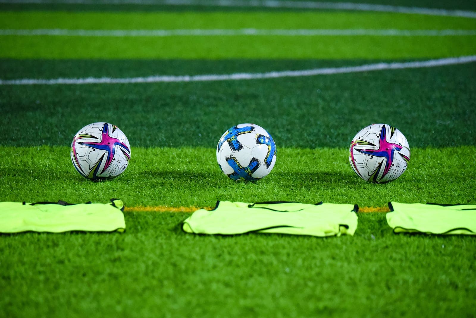 A soccer bag with a ball and gear beside it