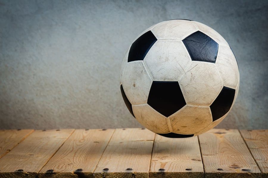 A patterned soccer ball photographed close up