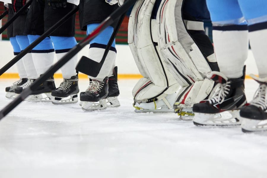 Protective sports guards photographed on a plain surface