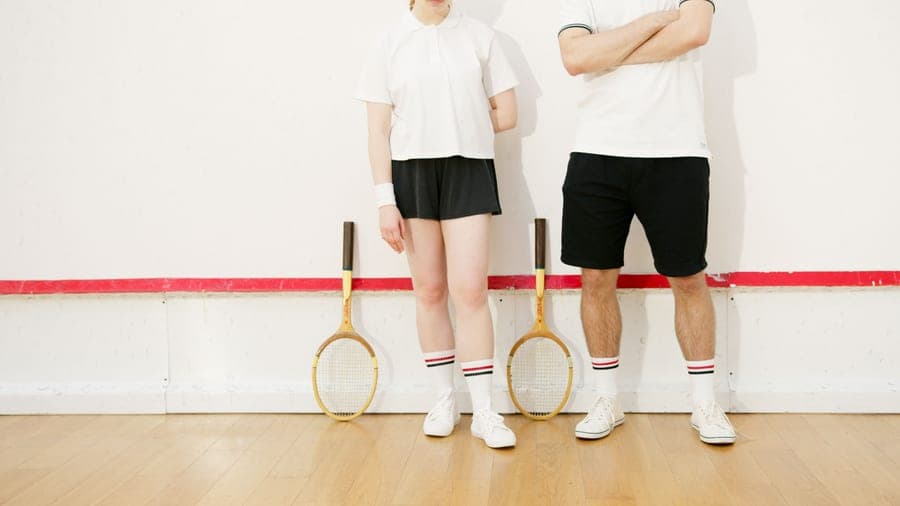 A pair of athletic socks on a plain surface