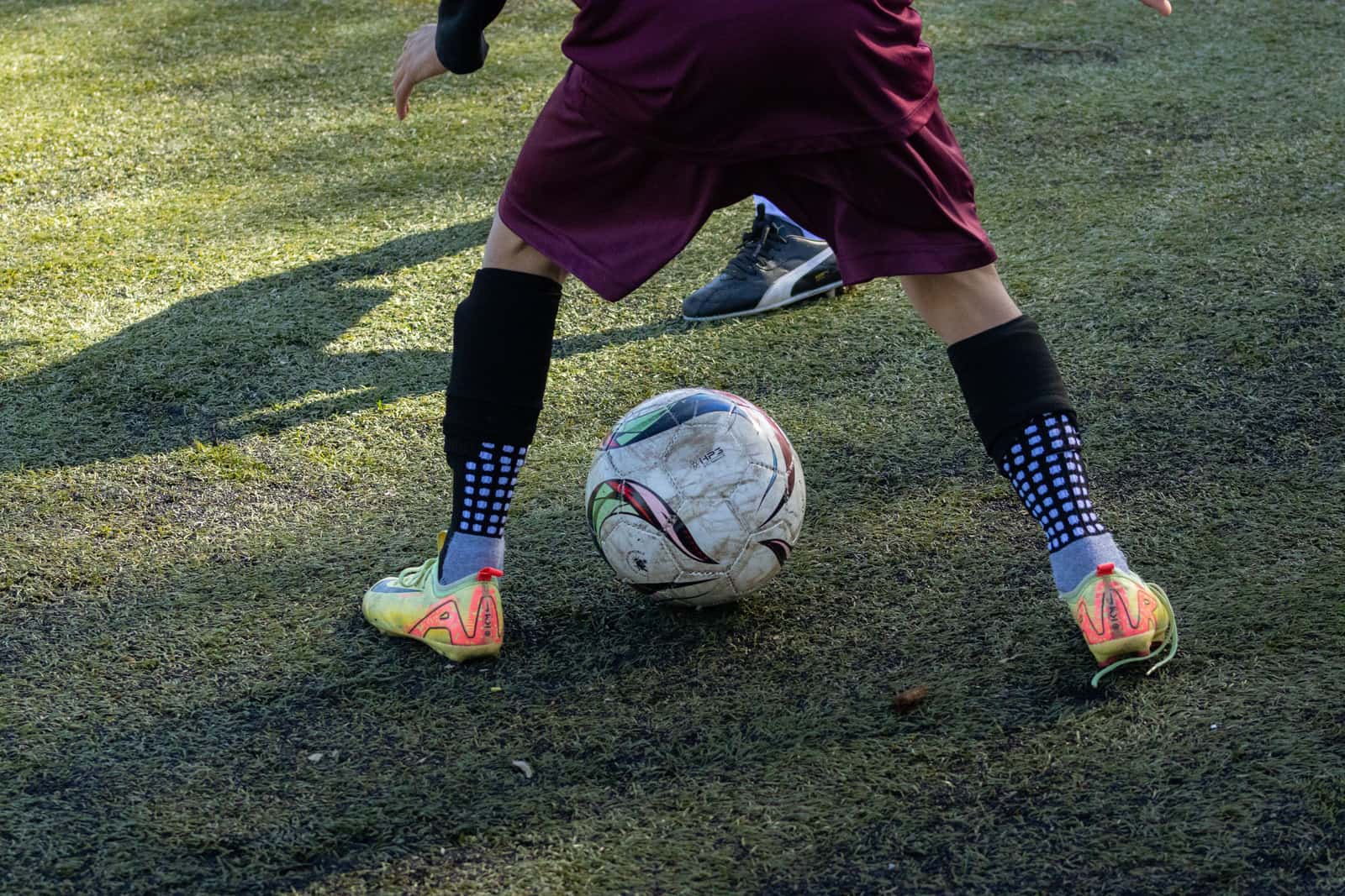 Youth soccer socks and shin protection laid out together